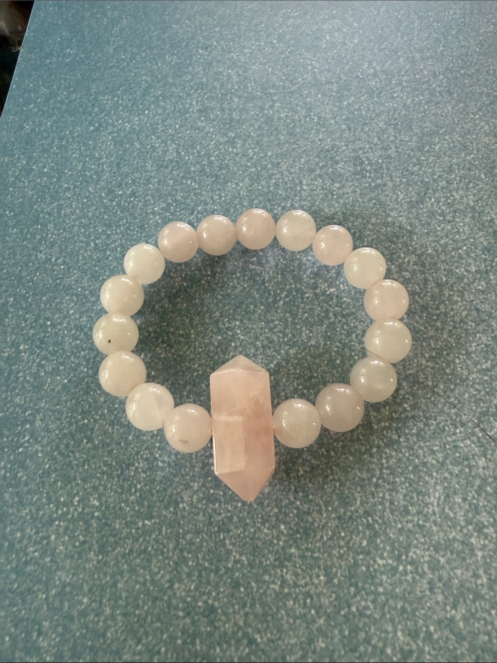 Off pink stretch bracelet.